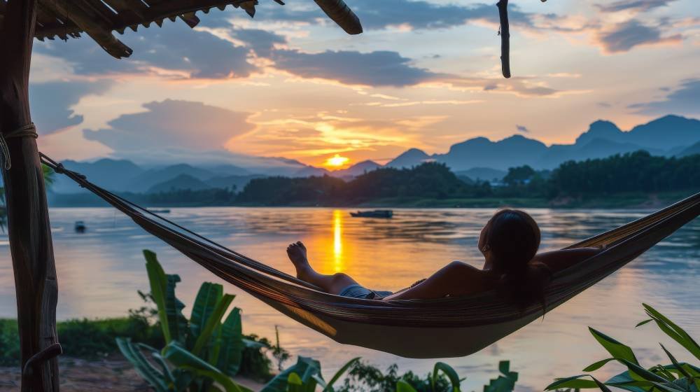 backpacker-relaxing-hammock-with-view-sunset-mekong-river-laos (1)